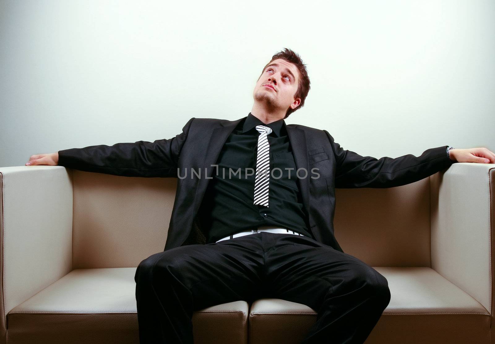 Businessman relaxing on lounge