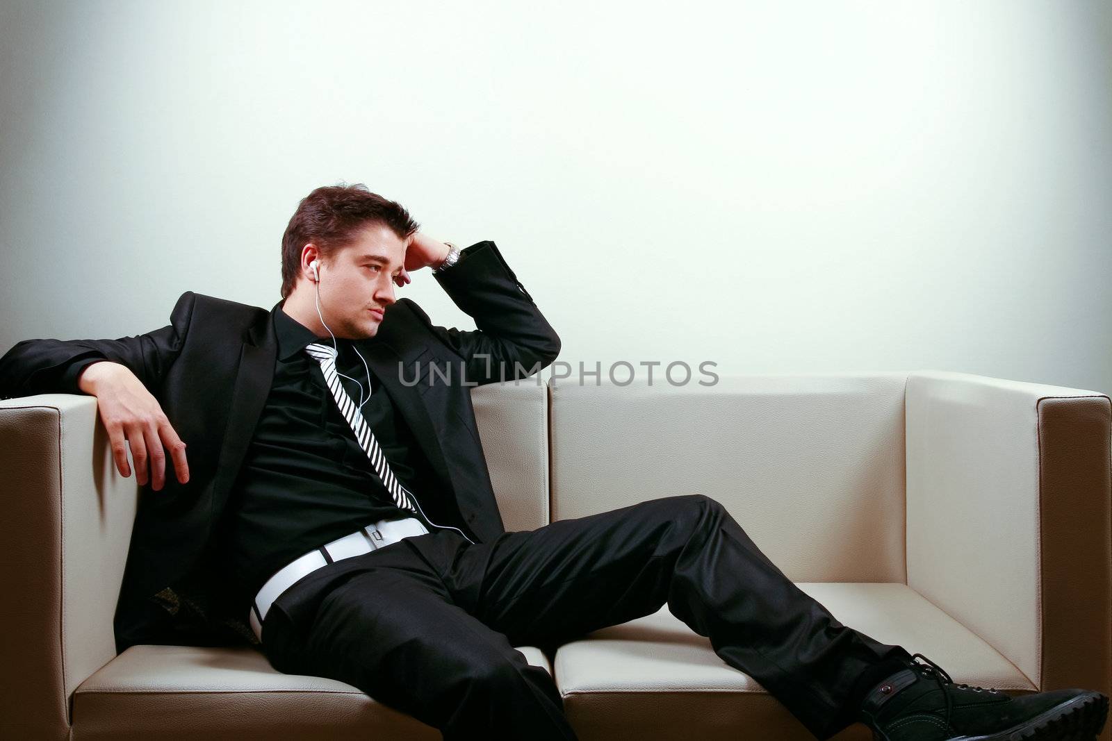 Businessman relaxing on lounge