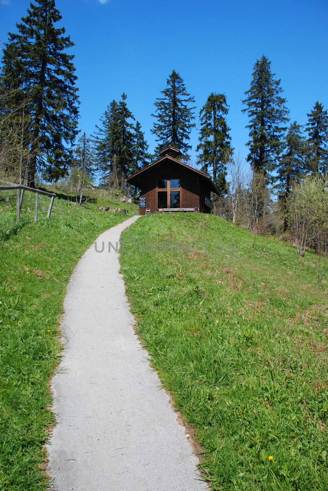 Walking passe leads to the Universal church in "Vue des Alpas" in Switzerland Jura, it is a worship place for people of any religion