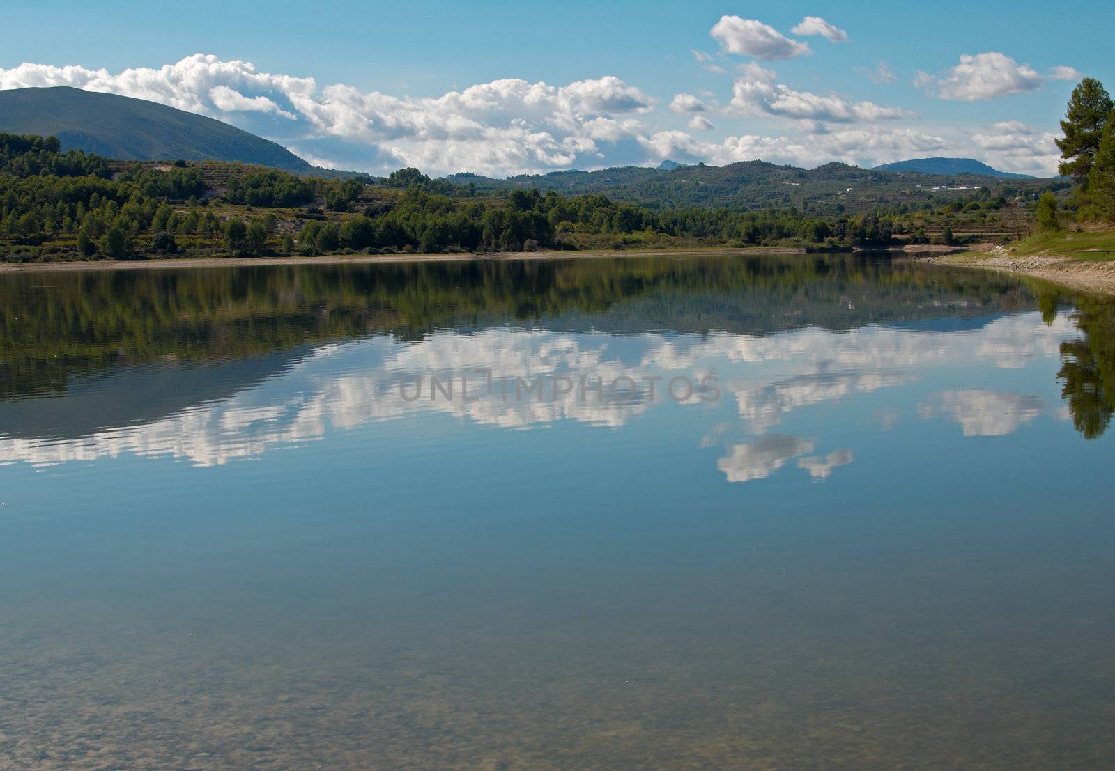 Peaceful lake landscape, the sky reflecting on its surface