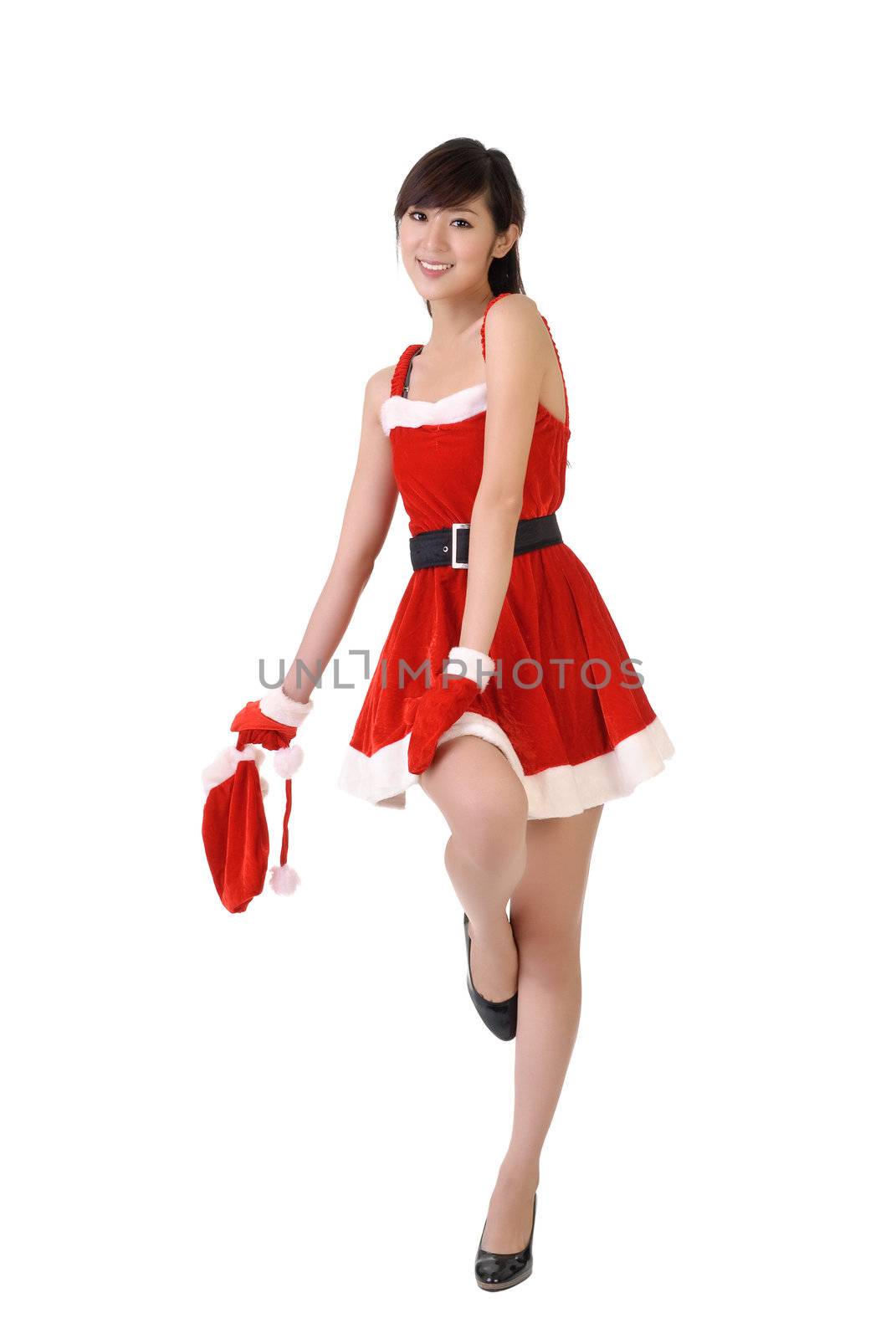 Beautiful Christmas beauty posing with joy, full length portrait isolated on white.