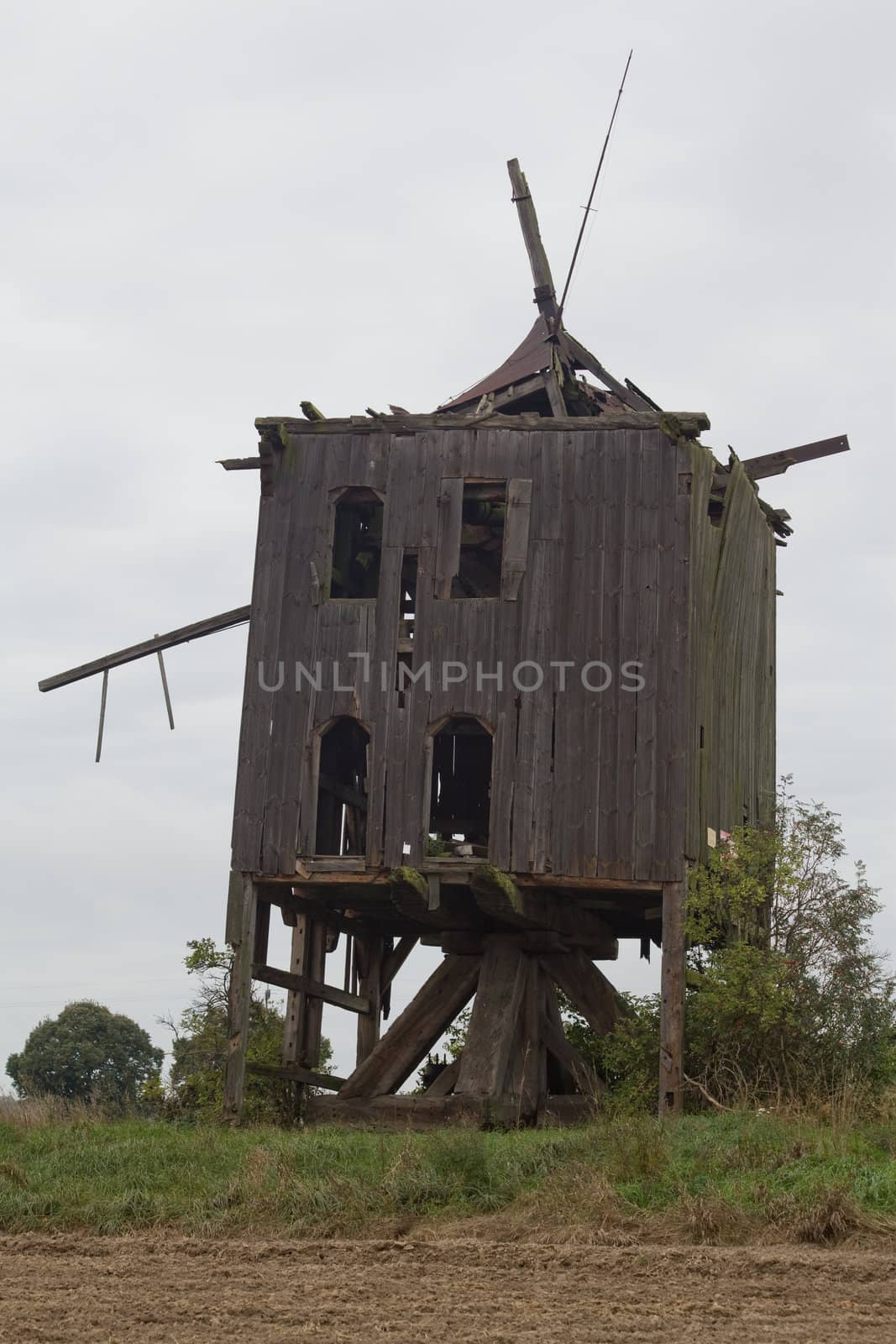 Old wooden windmill at the countryside
