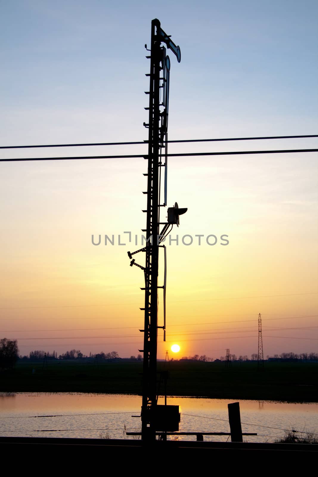 Railway semaphore silhouette during the sunset
