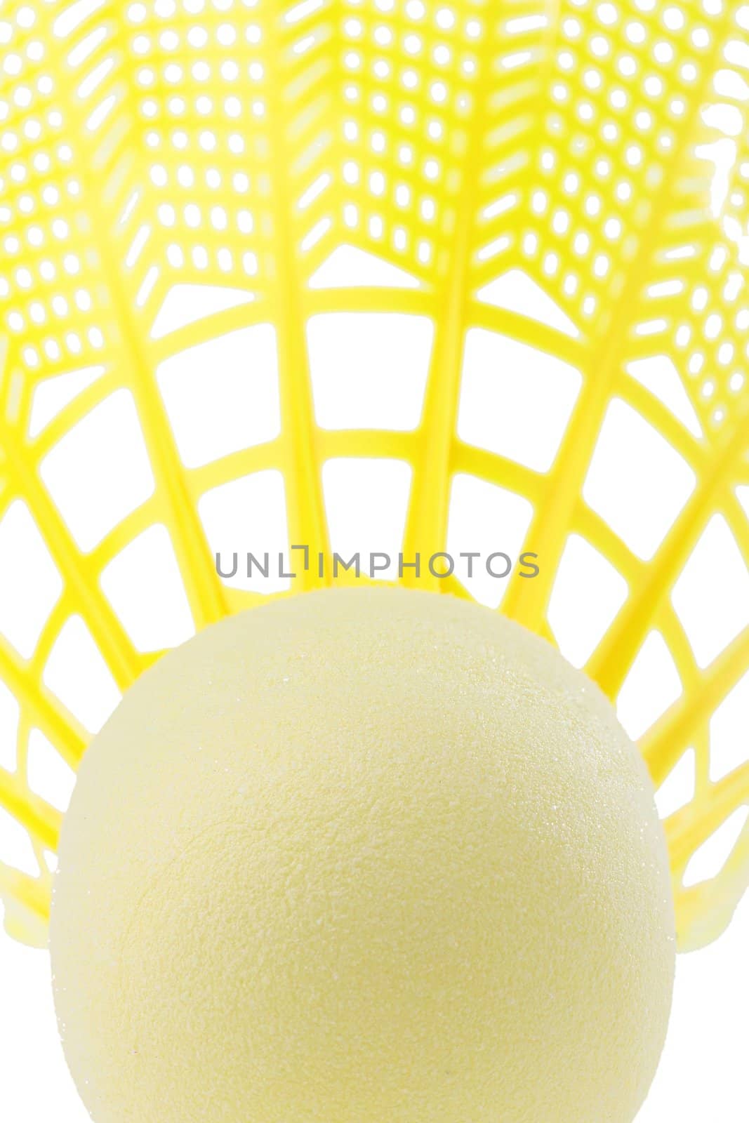 Close-up of a bright yellow badminton shuttlecock on a white background.