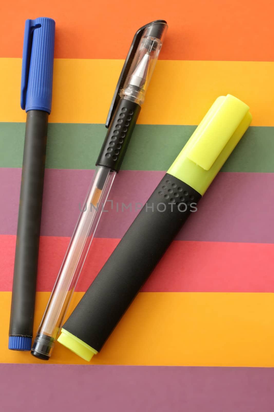 Highlight pens on a colorful background

