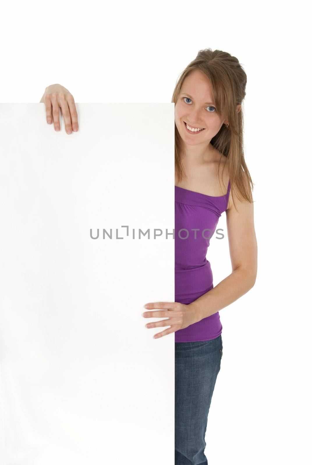 Casual young women holding a blank banner ad, smiling. Isolated on white.