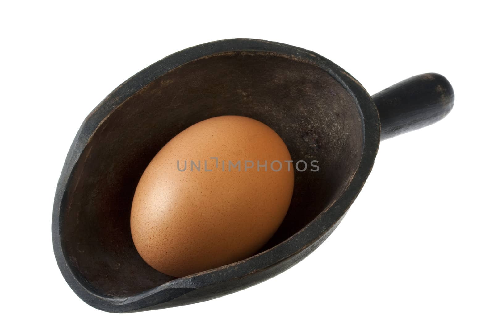 brown chicken egg on a vintage, wooden, rough scoop isolated on white 