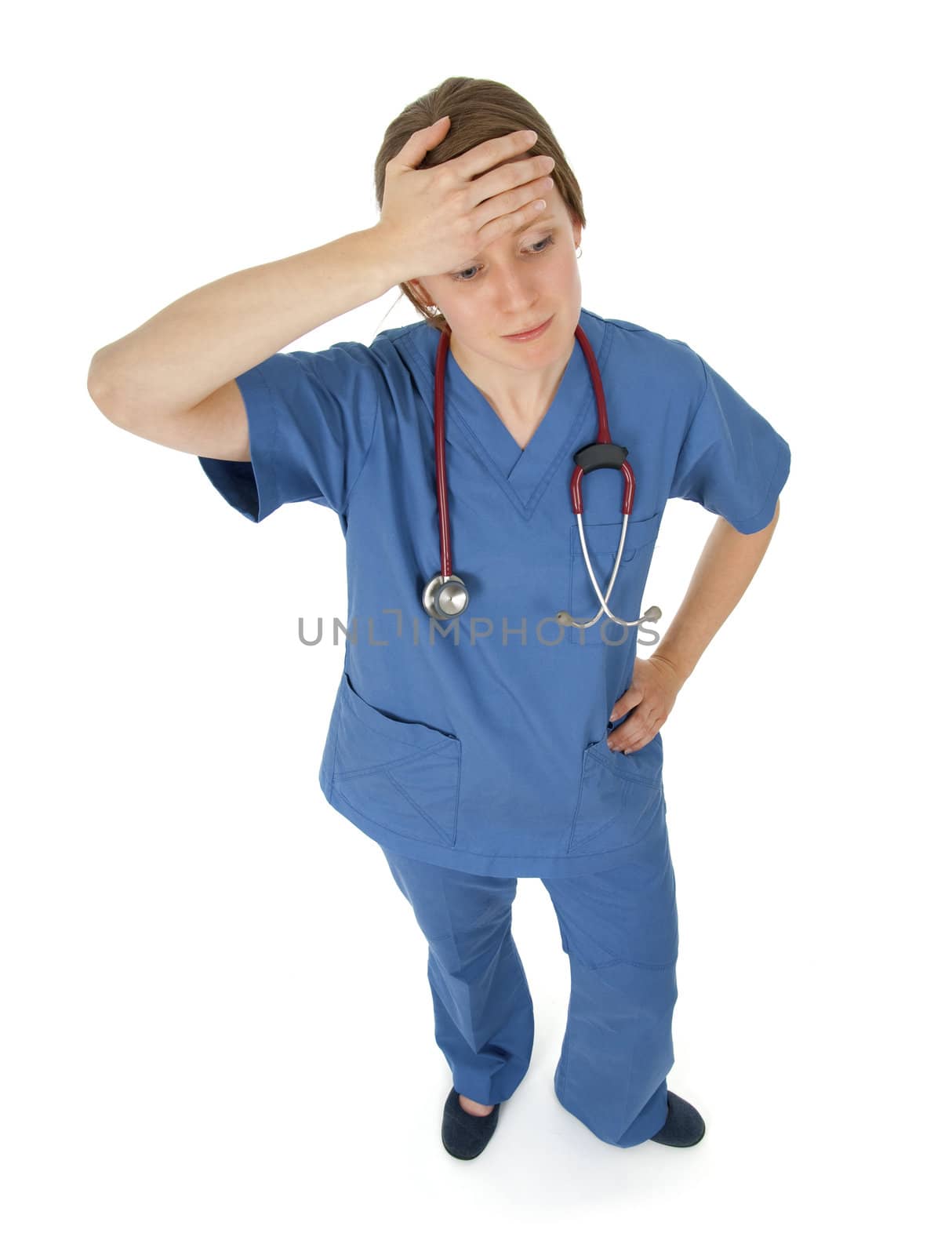 Tired young nurse having headache, isolated on white.
