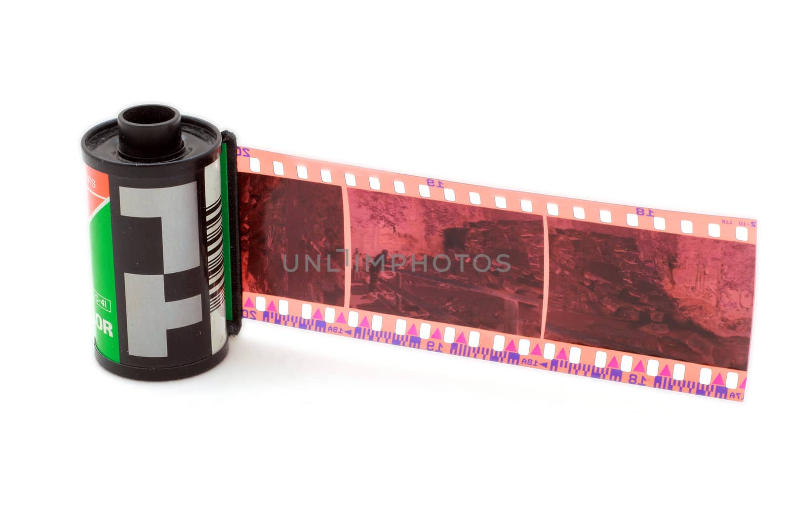 35 mm negative film and roll isolated in white background
