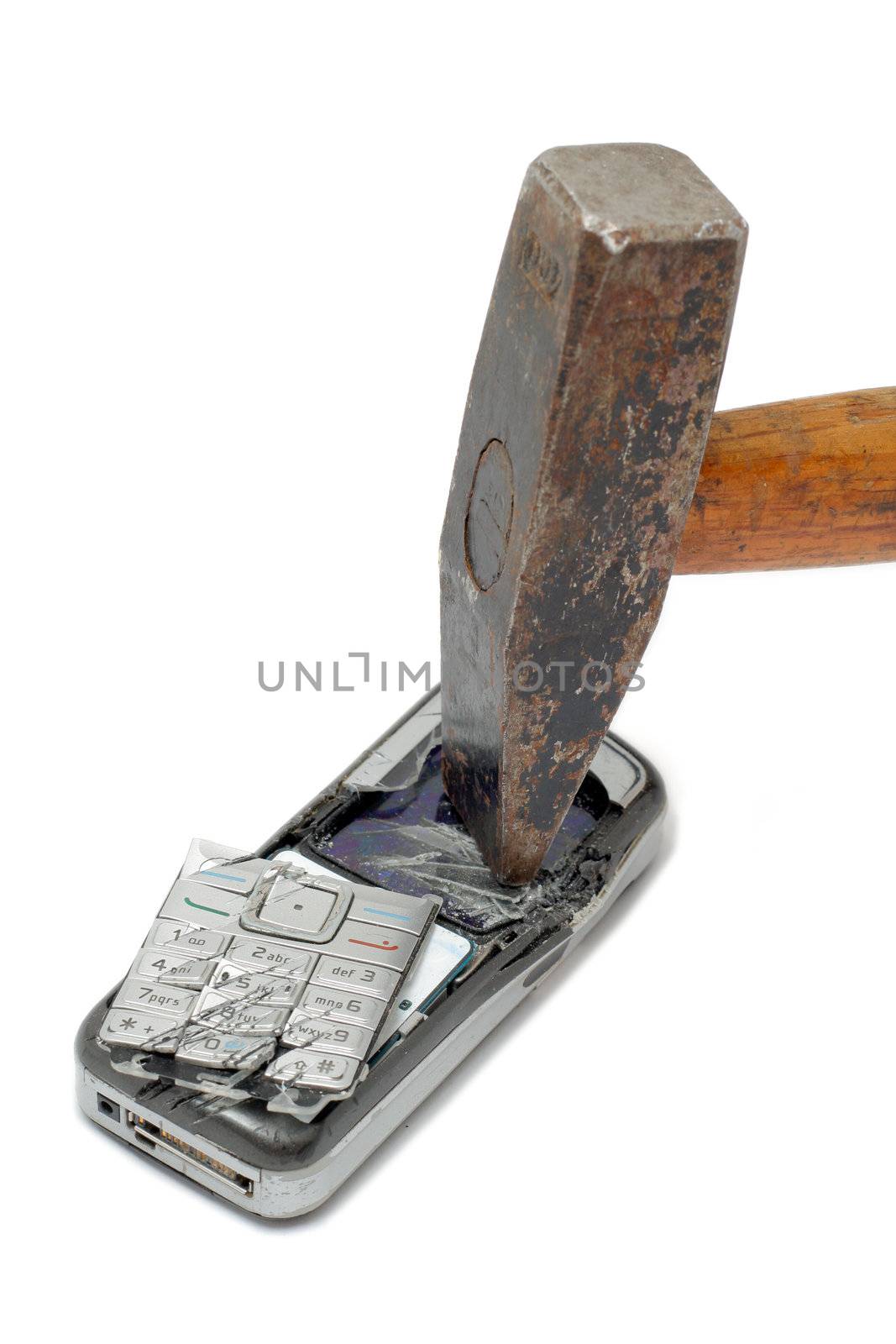 Hammer smashing cellular phone isolated on the white background