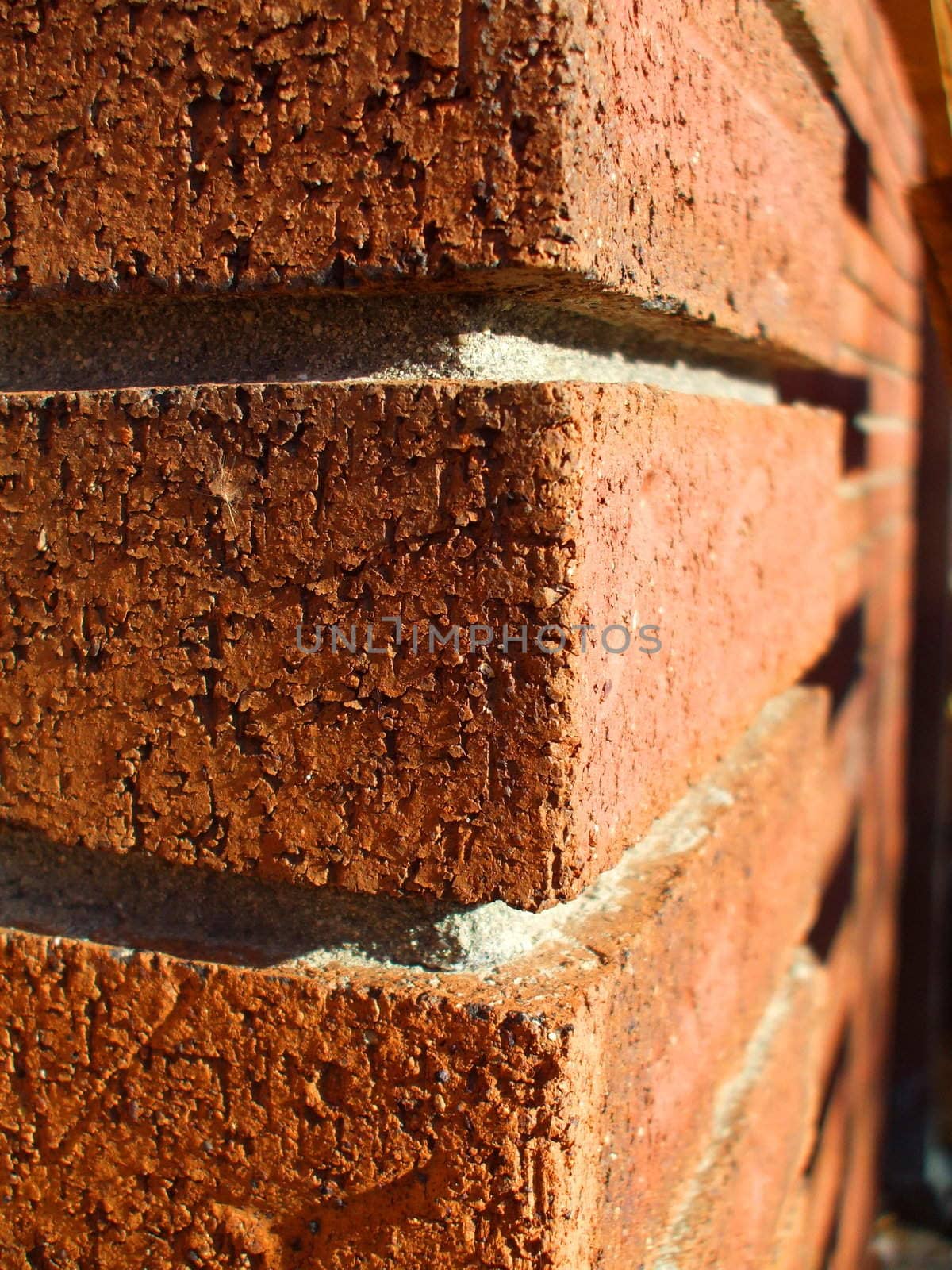 Corner of a brick building close up.