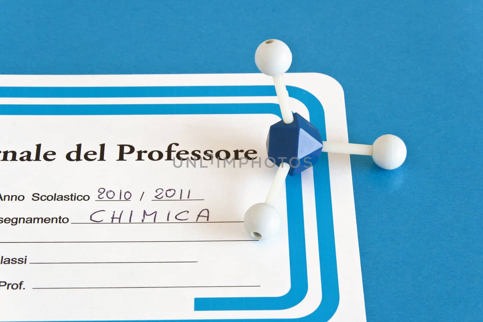 closeup of italian teacher's register with molecular model