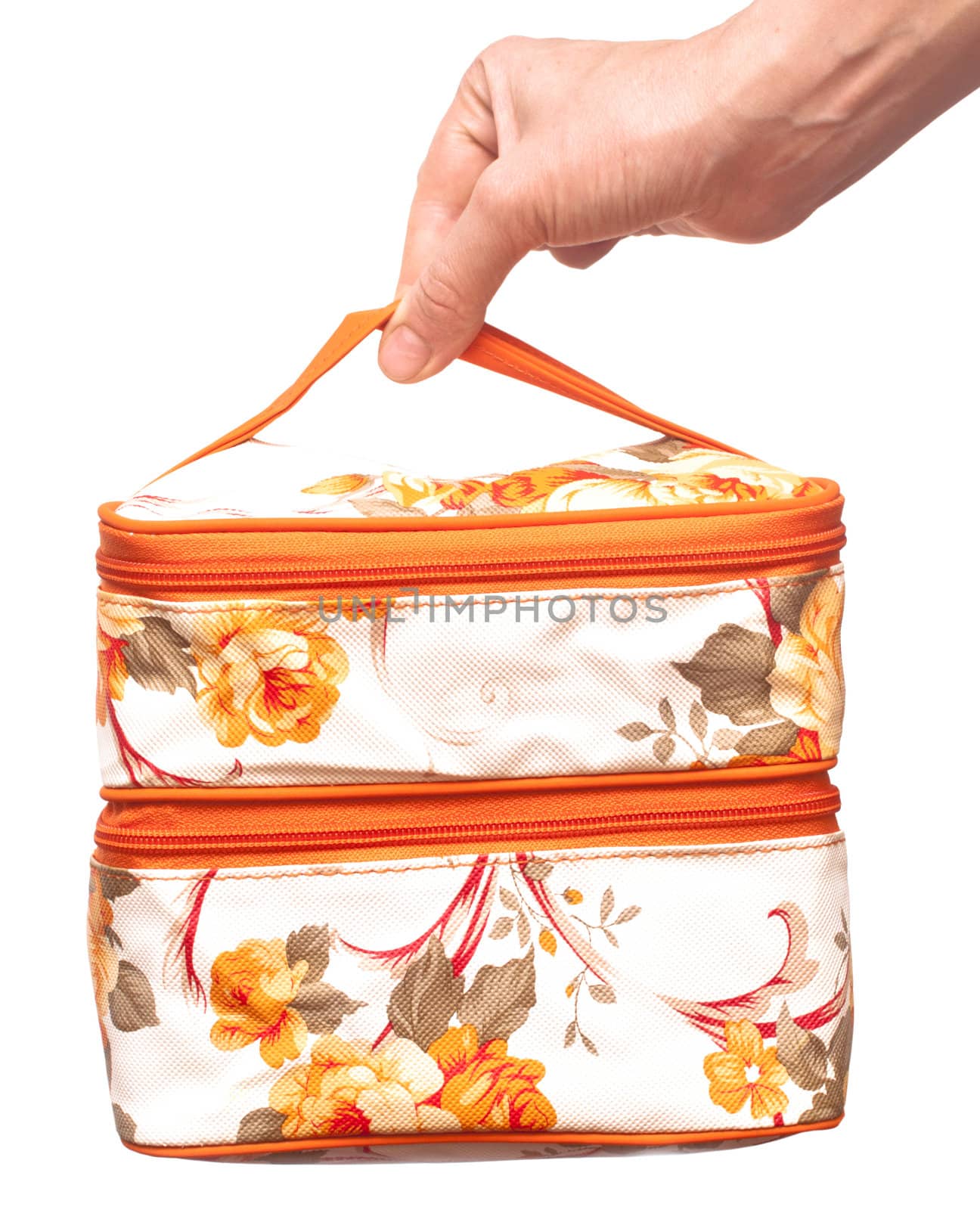 cosmetic bag in hand is isolated on the white