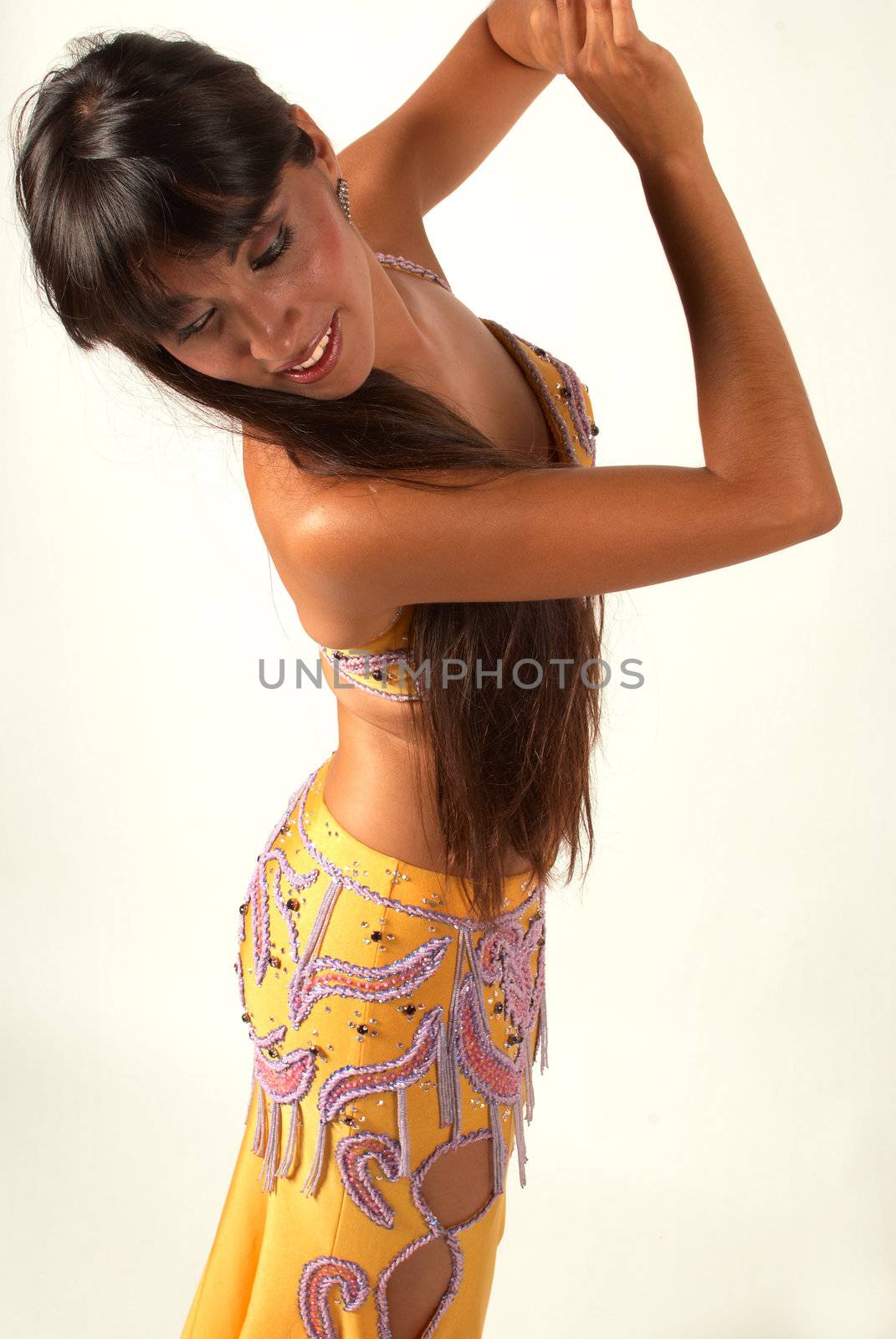 An oriental belly dancer in swinging pose