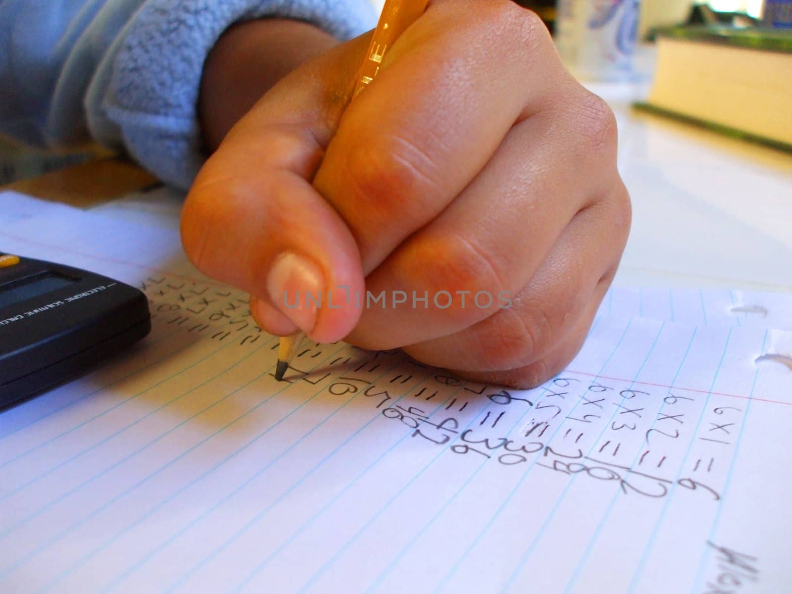 Child doing homework in a house.