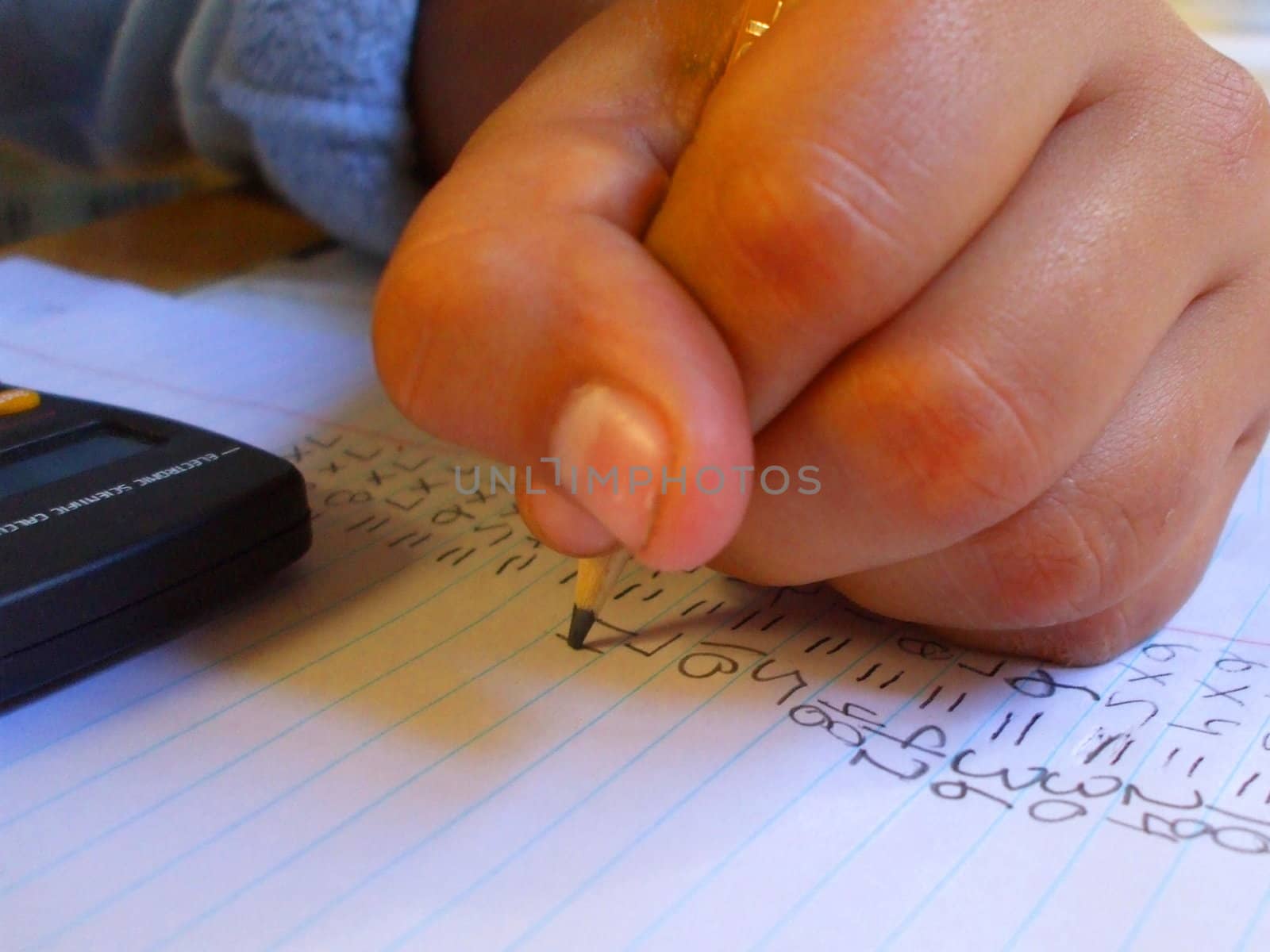 Child doing homework in a house.