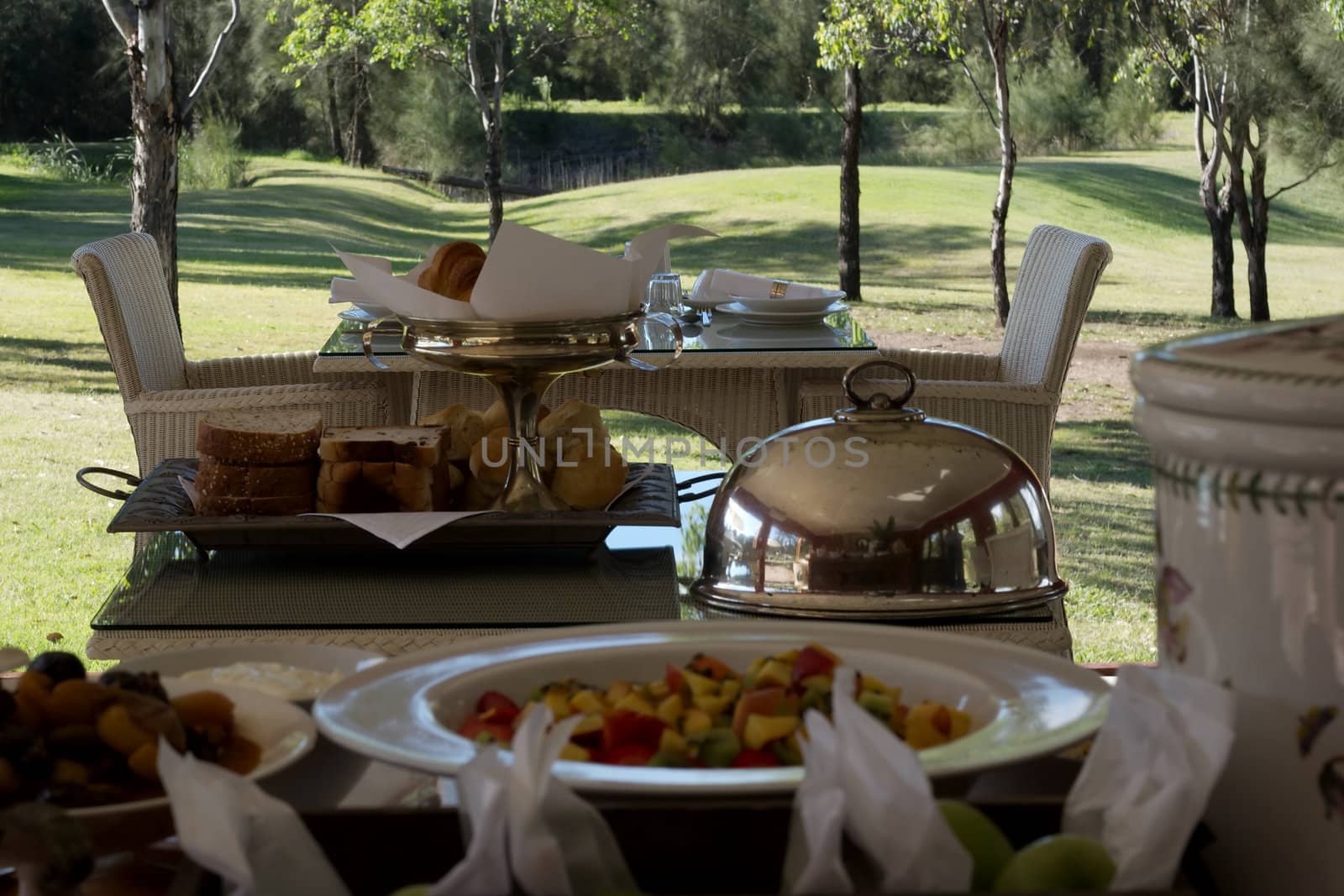 Breakfast breads and fruit platter with silver trays