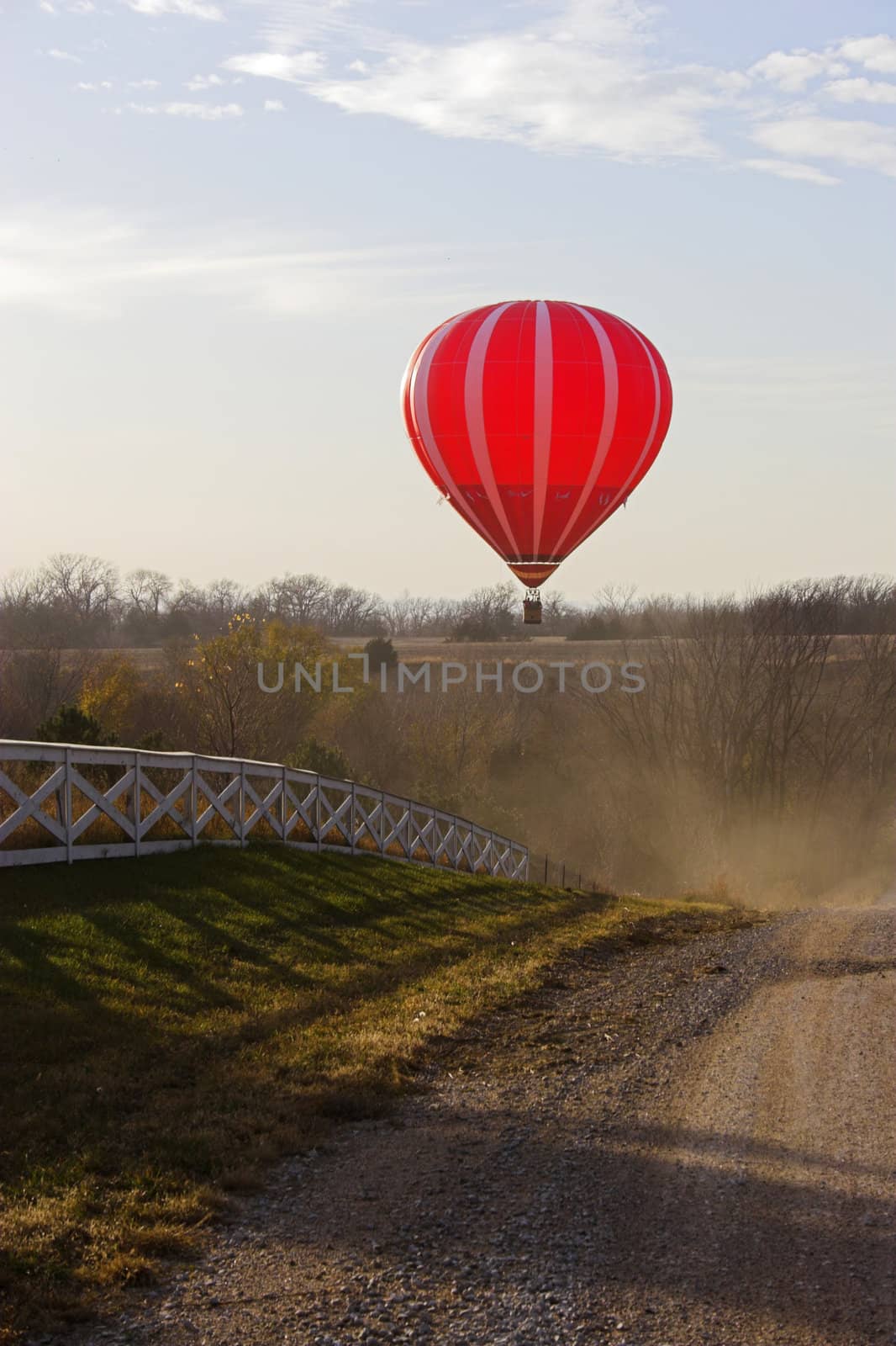 Red hot air balloon over farm fields near Omaha Nebraska