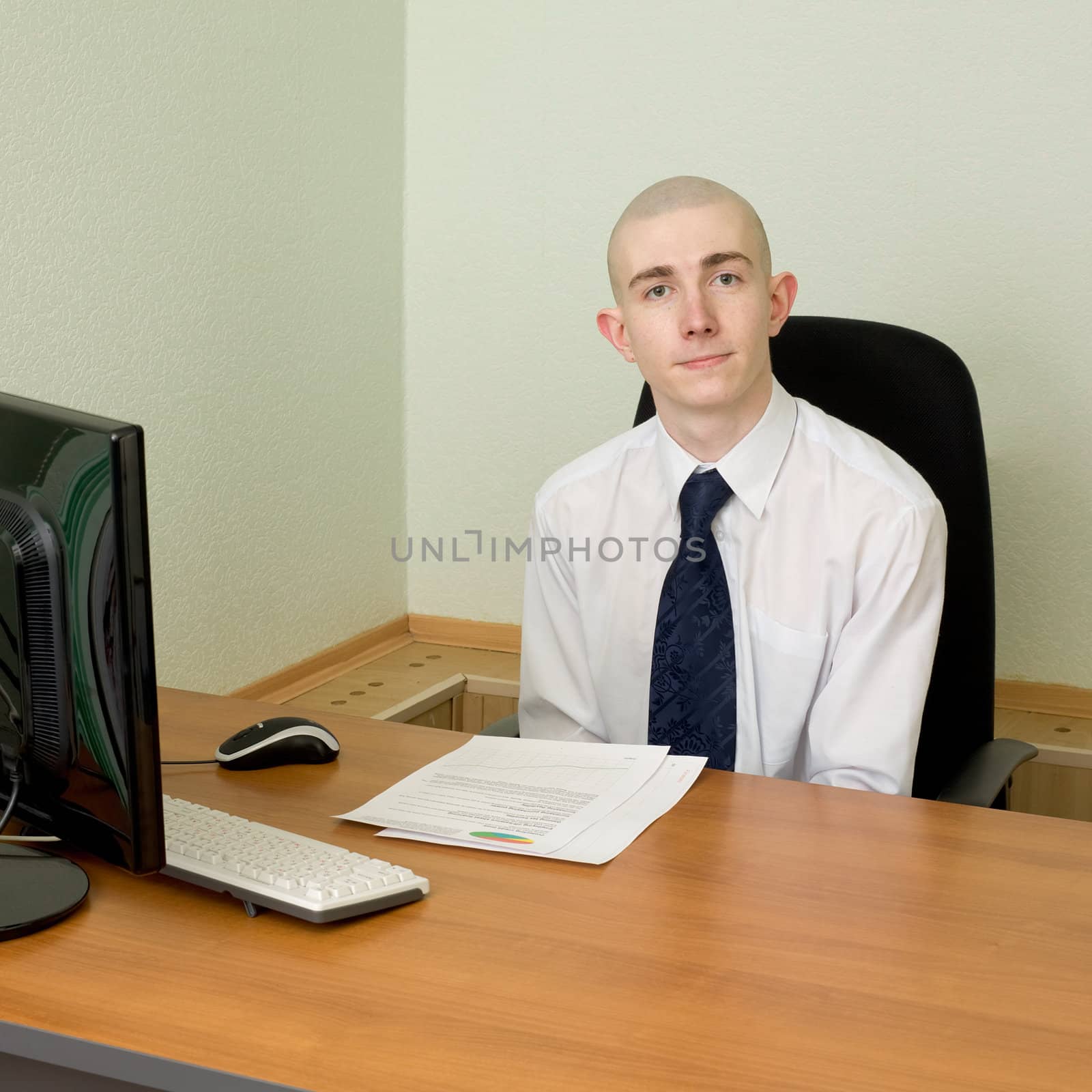 The businessman in a white shirt on a workplace