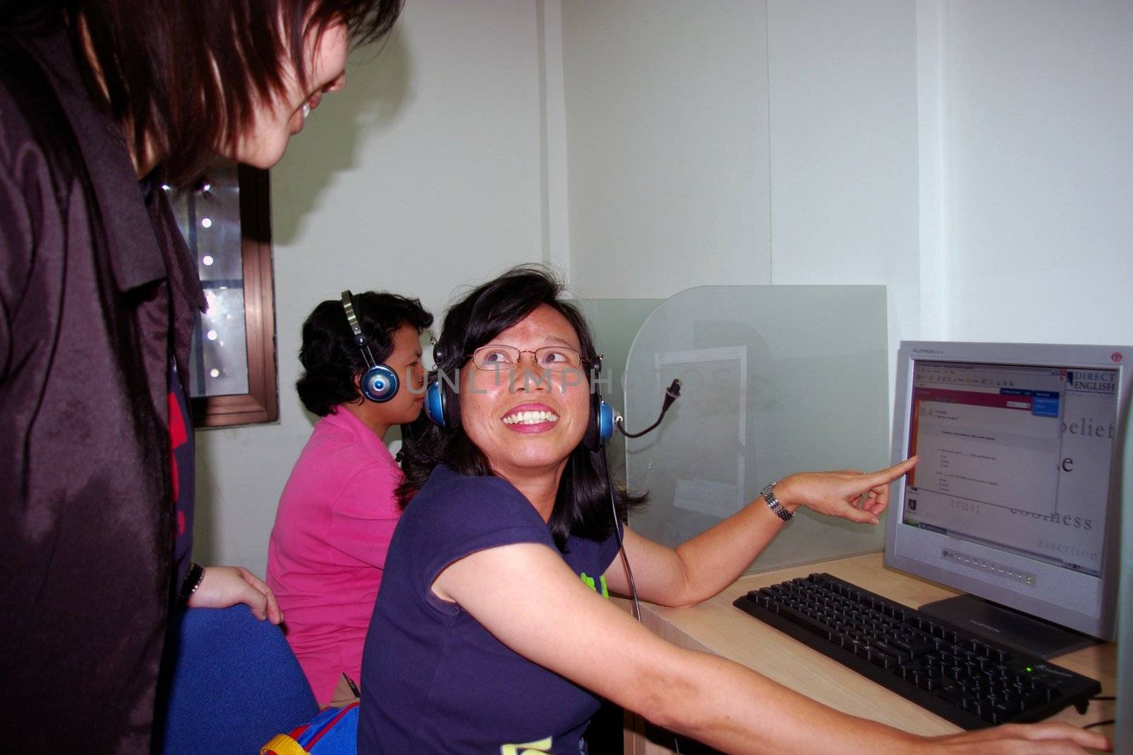 Students learning English in a multimedia language lab, Surabaya, Indonesia.