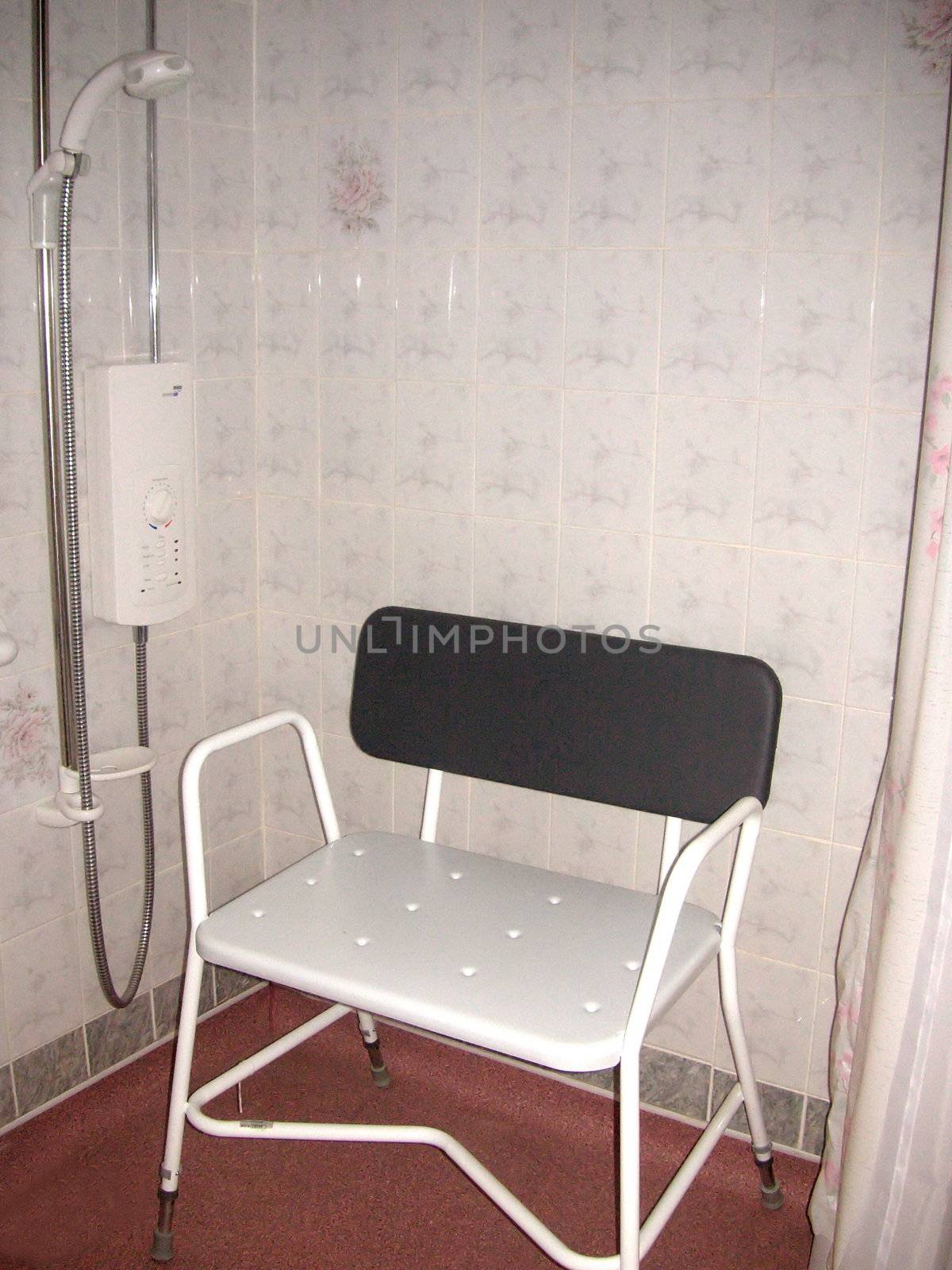 disabled persons shower-chair in the shower area