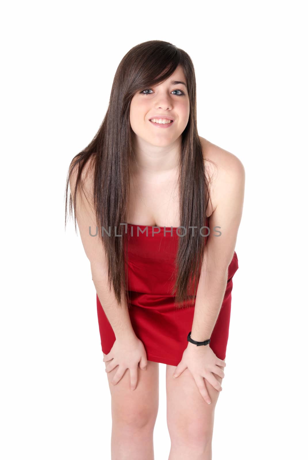 Young beautiful girl with red dress standing isolated on white background. by dgmata