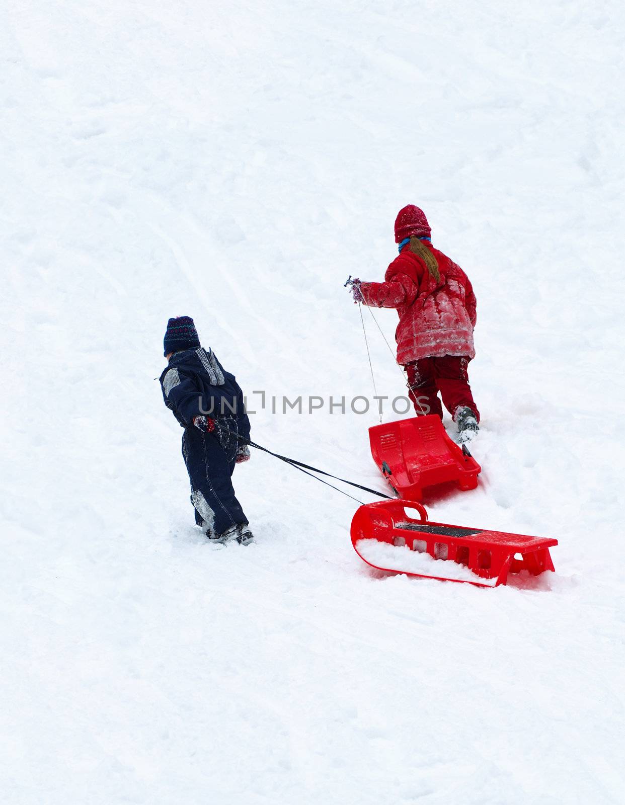 Winter entertainments of children. Driving on sledge.