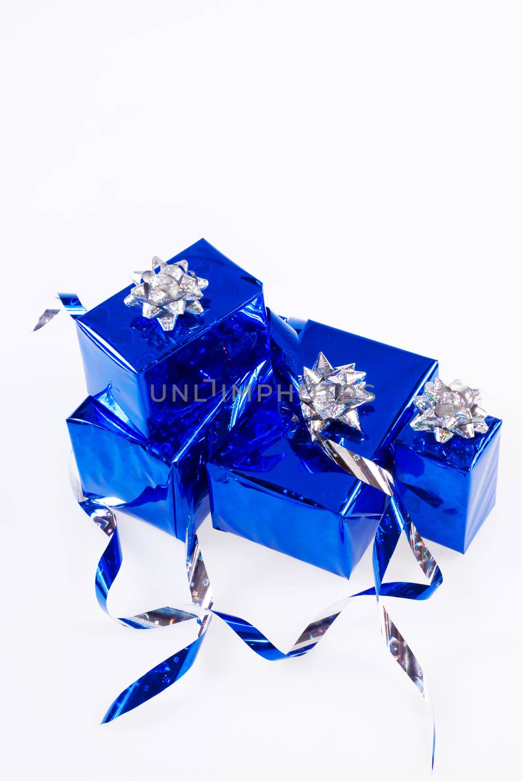 Many blue shiny boxes for gifts with ribbons and tapes