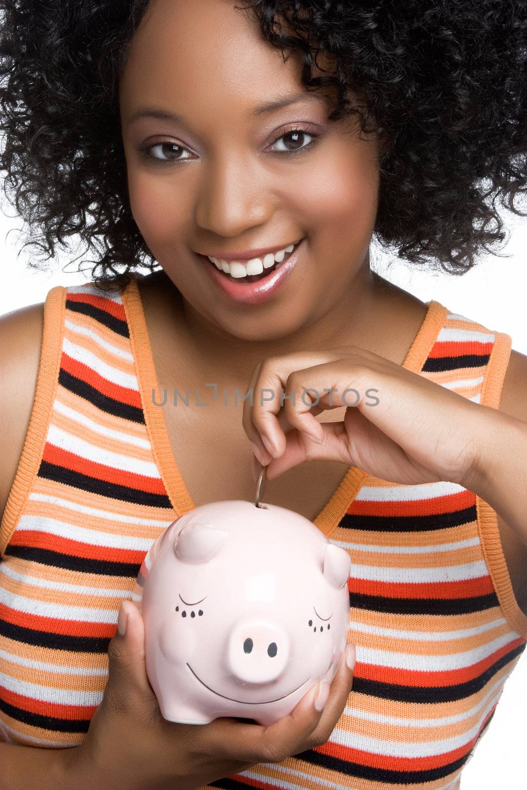 Woman dropping coin in money pig