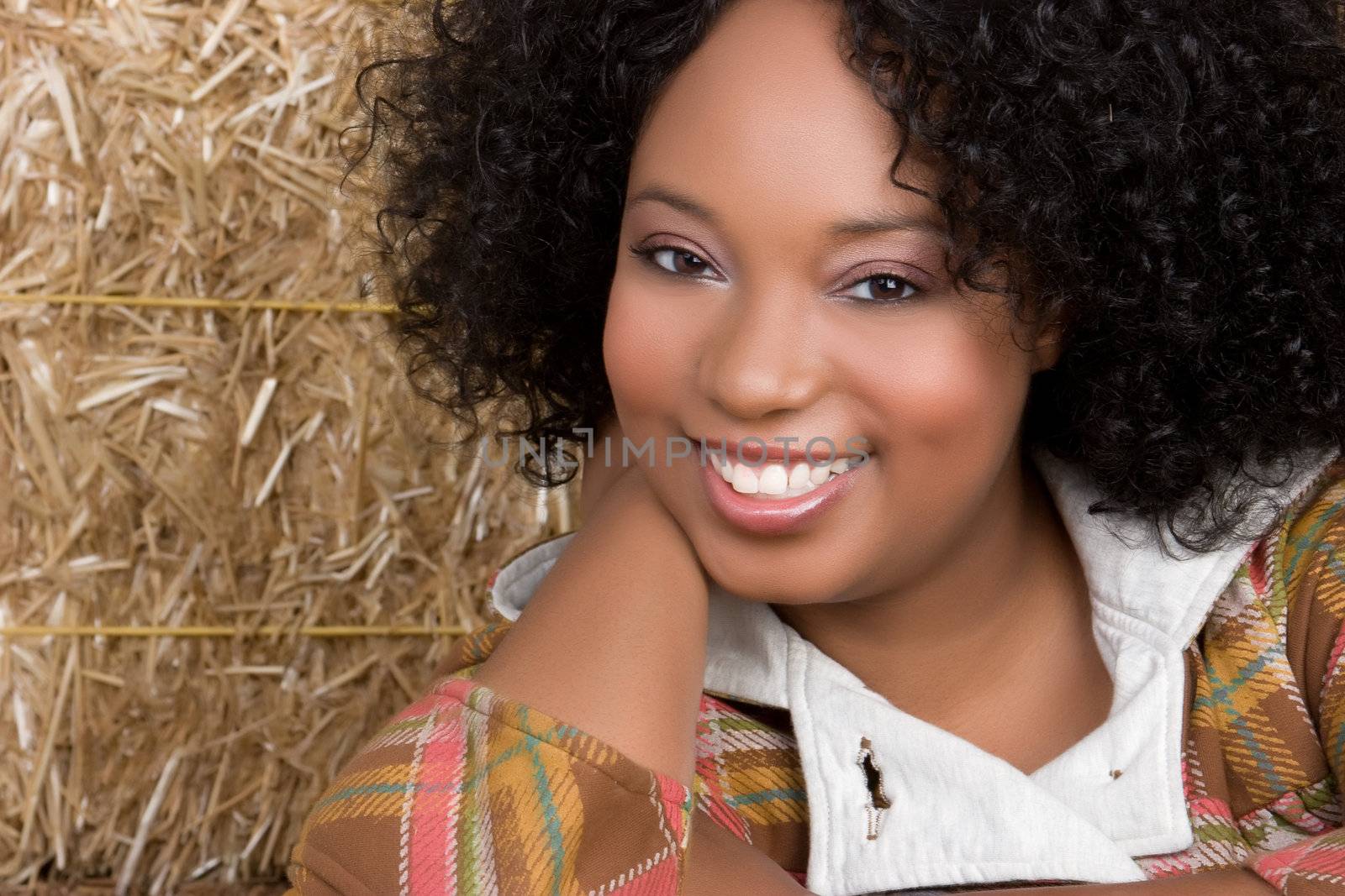 Smiling beautiful woman in hay