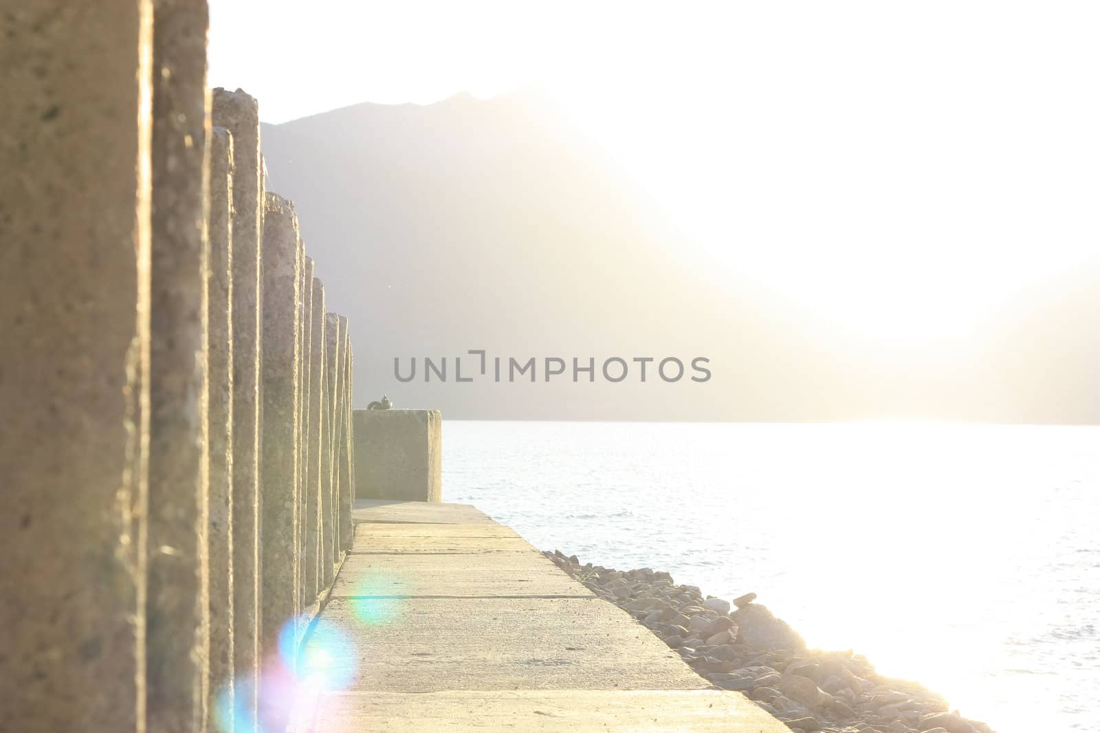 lake and mountain view against the sun