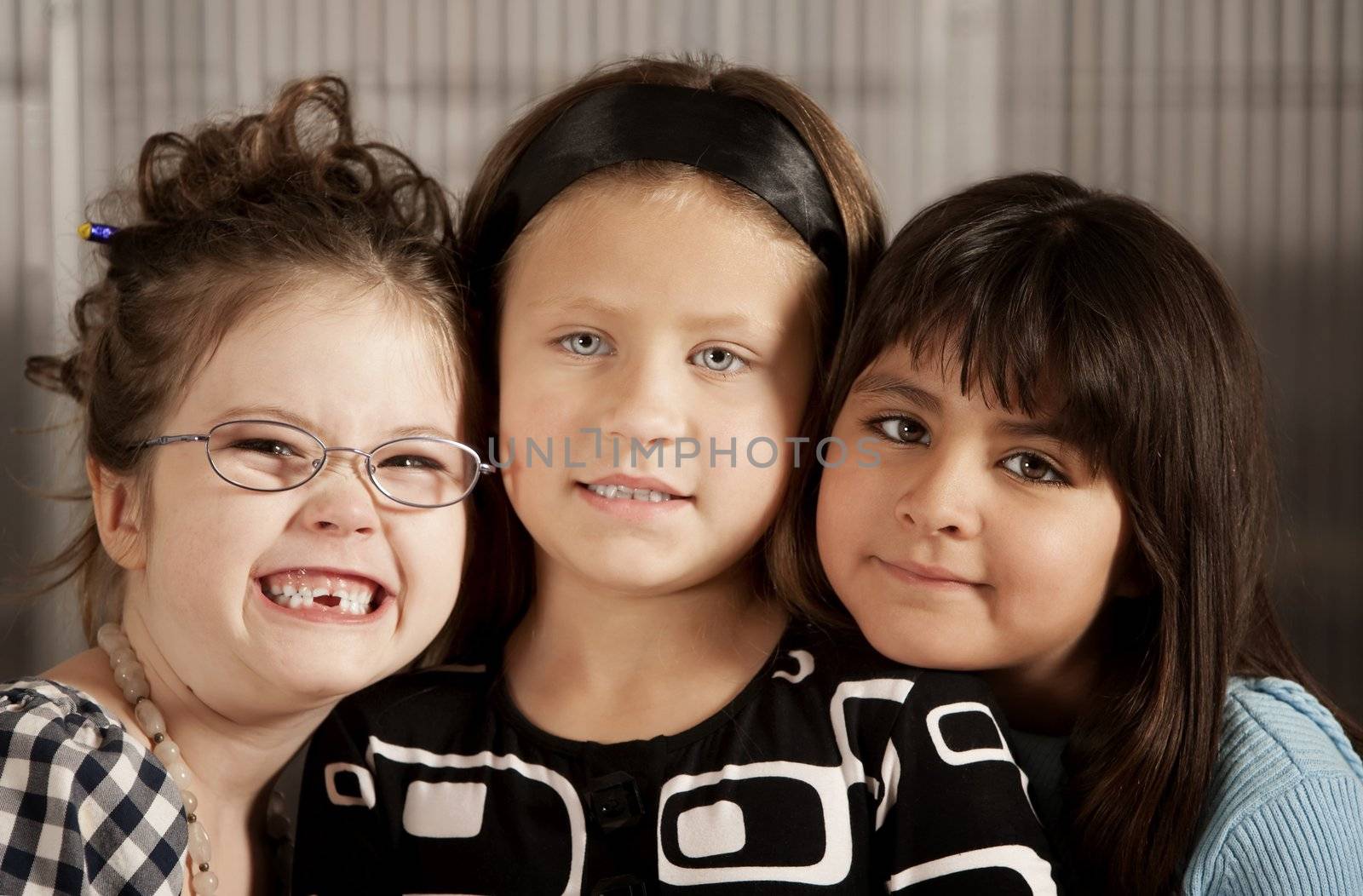Portrait of three cute young elementery school girls