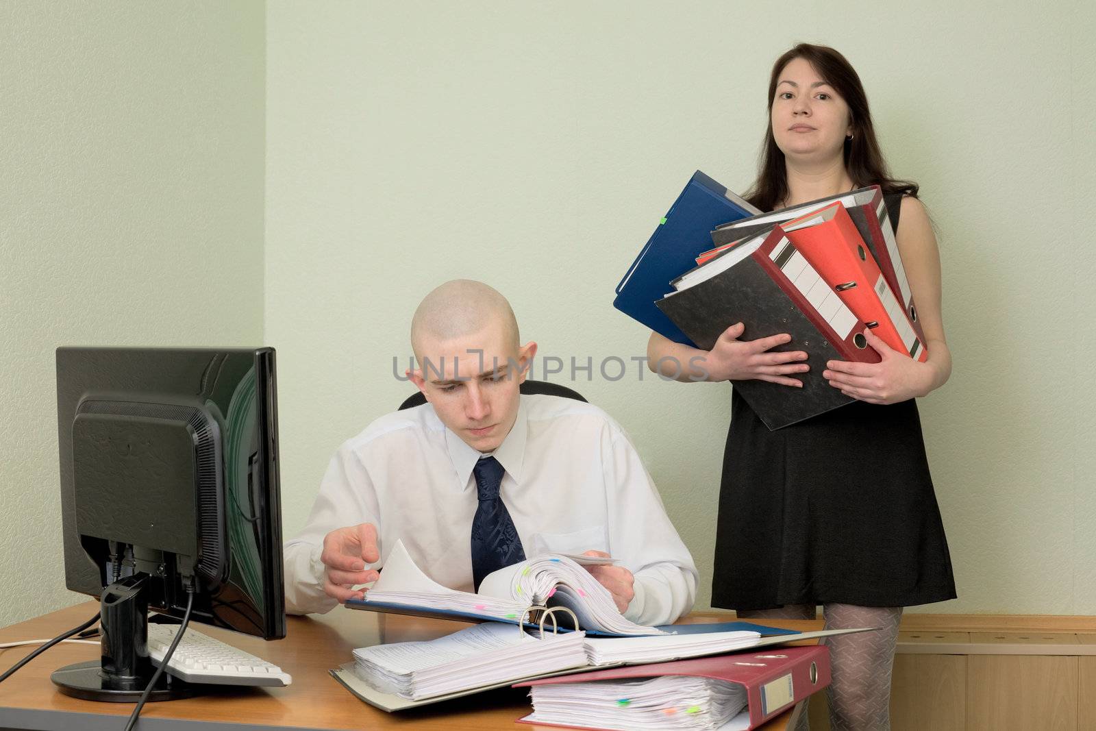 The bookkeeper and the secretary on a workplace at office