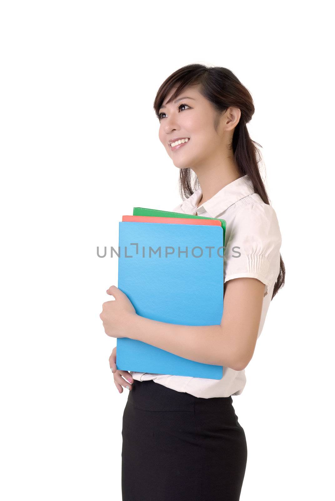Attractive secretary holding files with smile against white background.