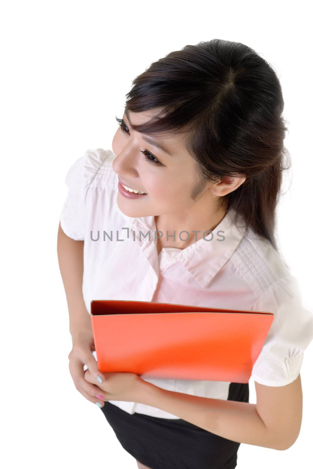 Secretary holding files with smiling expression against white.