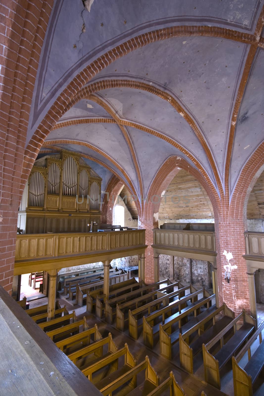 inside of a village church decorated for christmas