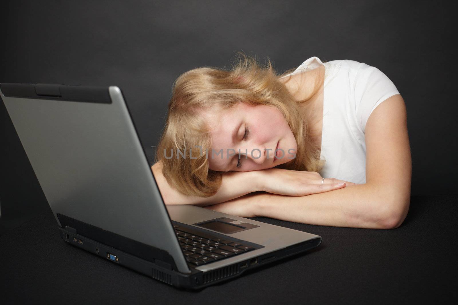Young woman tired from work in the internet and went to sleep