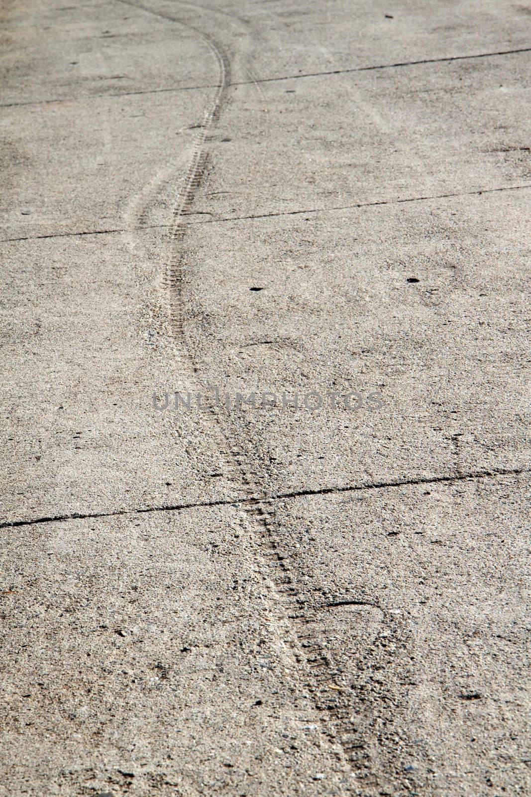 Track in cement sidewalk by bobkeenan