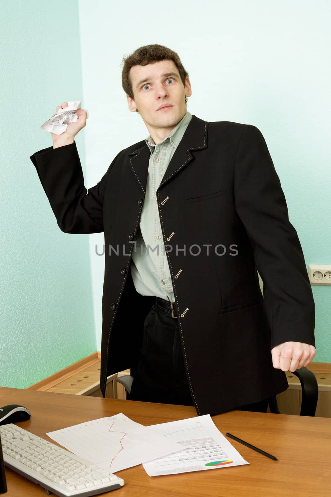 The director on a workplace with a crushed paper in a hand