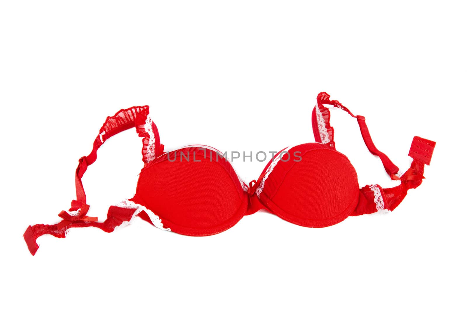 Red lacy bra over white background