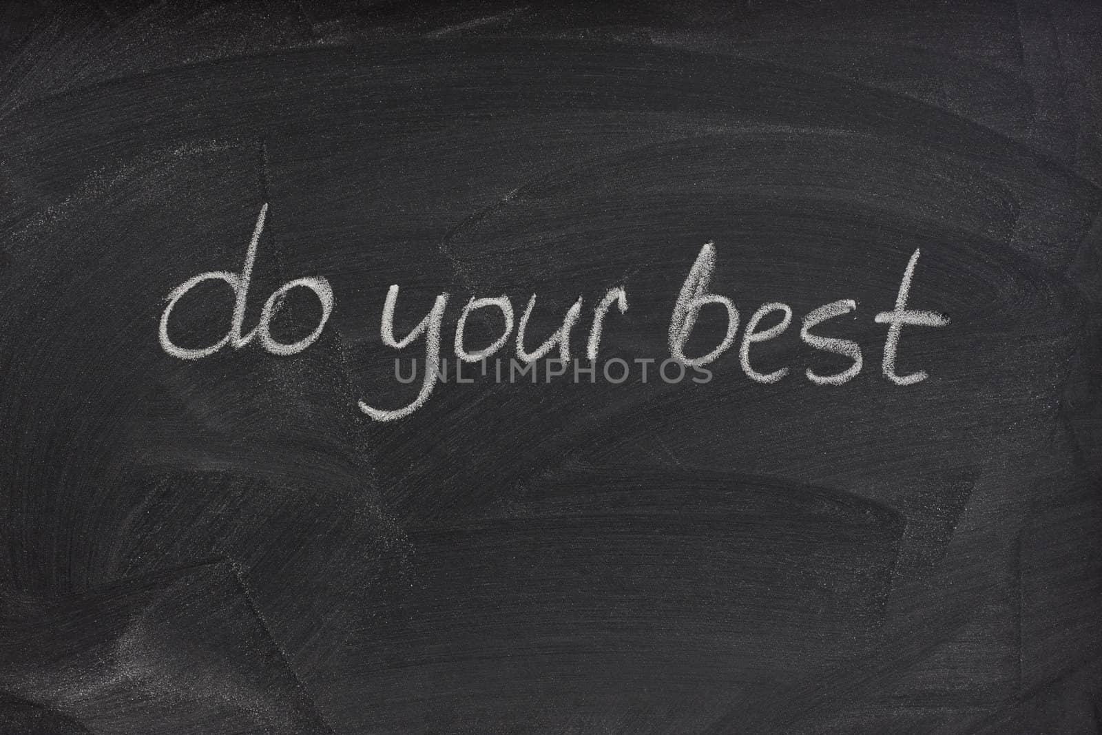 do your best - motivational phrase handwritten with white chalk on a blackboard with eraser smudge patterns