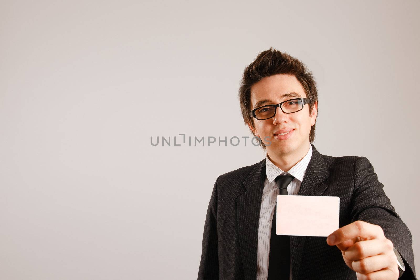 Business man holding blank business card