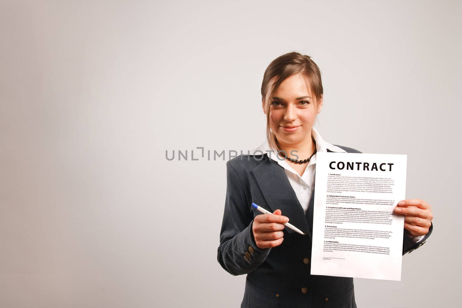 Business woman holding a printed contract