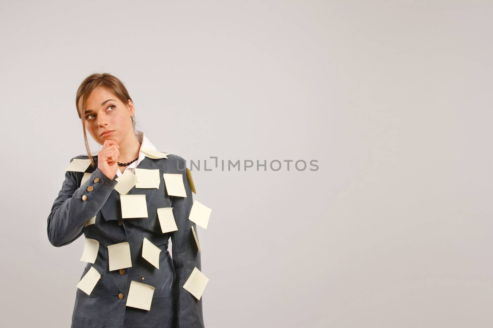 Young businesswoman with stickers on her suit by photovibes