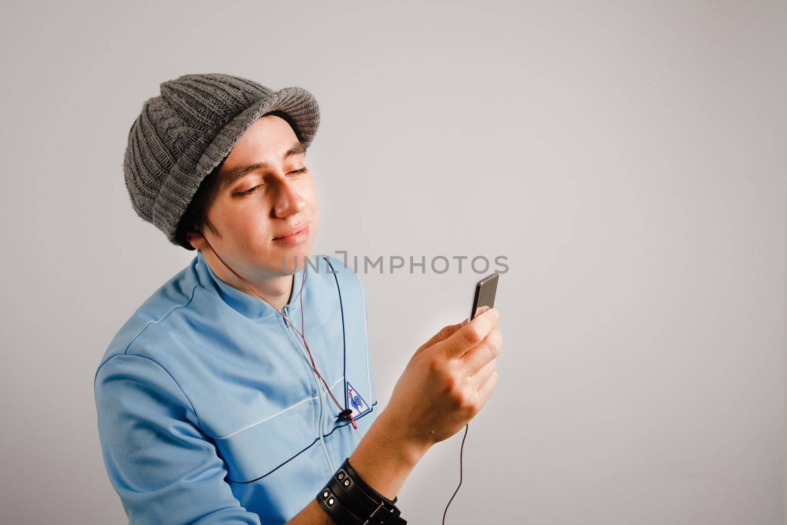 Stylish young man listening to music