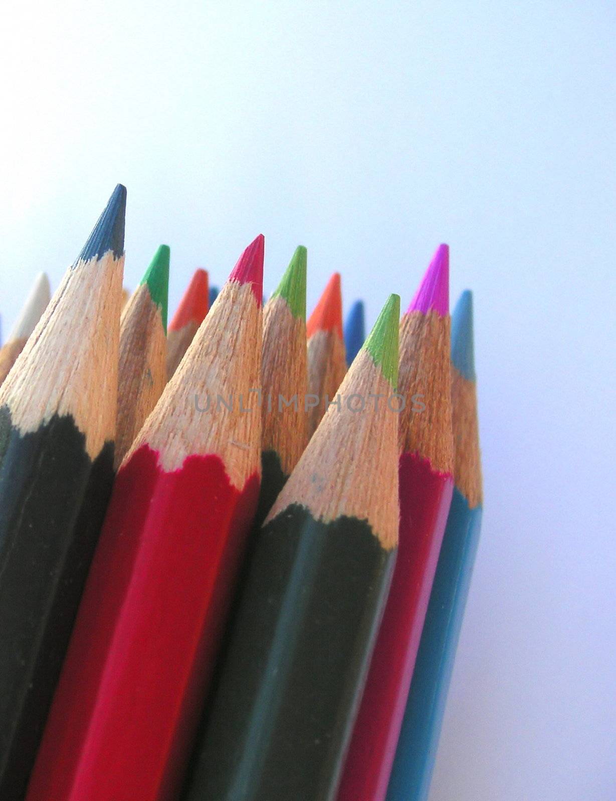 pencil crayons against a blue background