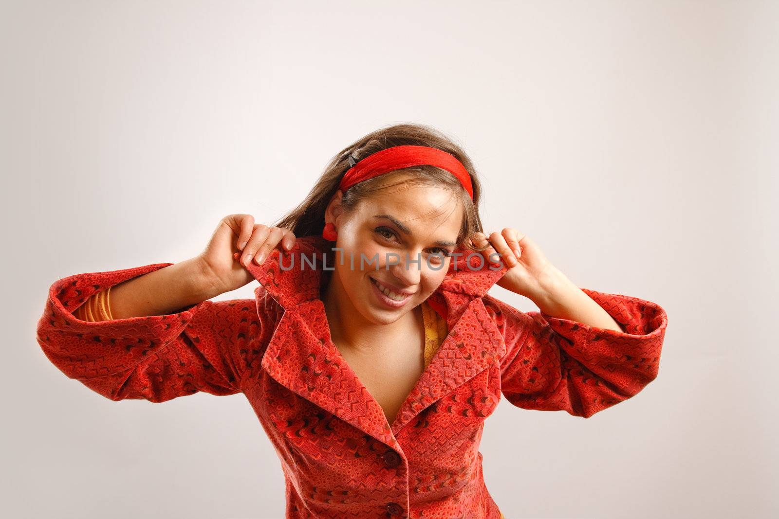 Portrait of attractive beautiful young woman wearing red jacket by photovibes