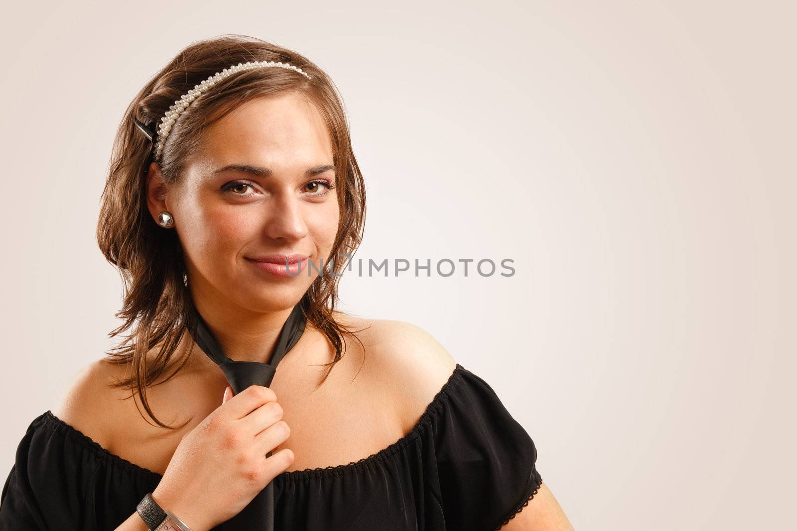 Portrait of attractive beautiful young woman wearing black dress by photovibes