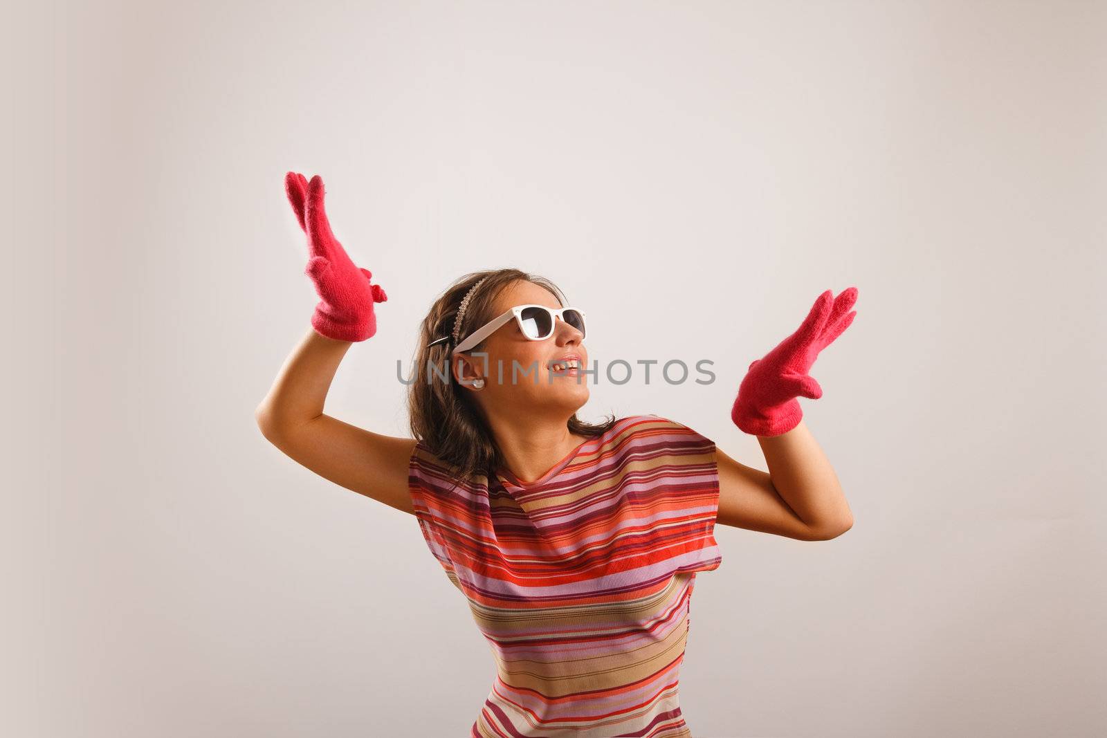 Modern looking young woman wearing sun glasses