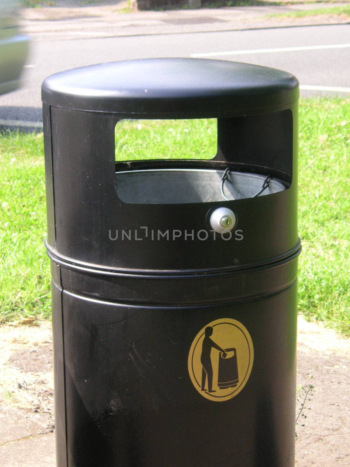 black waste bin by leafy